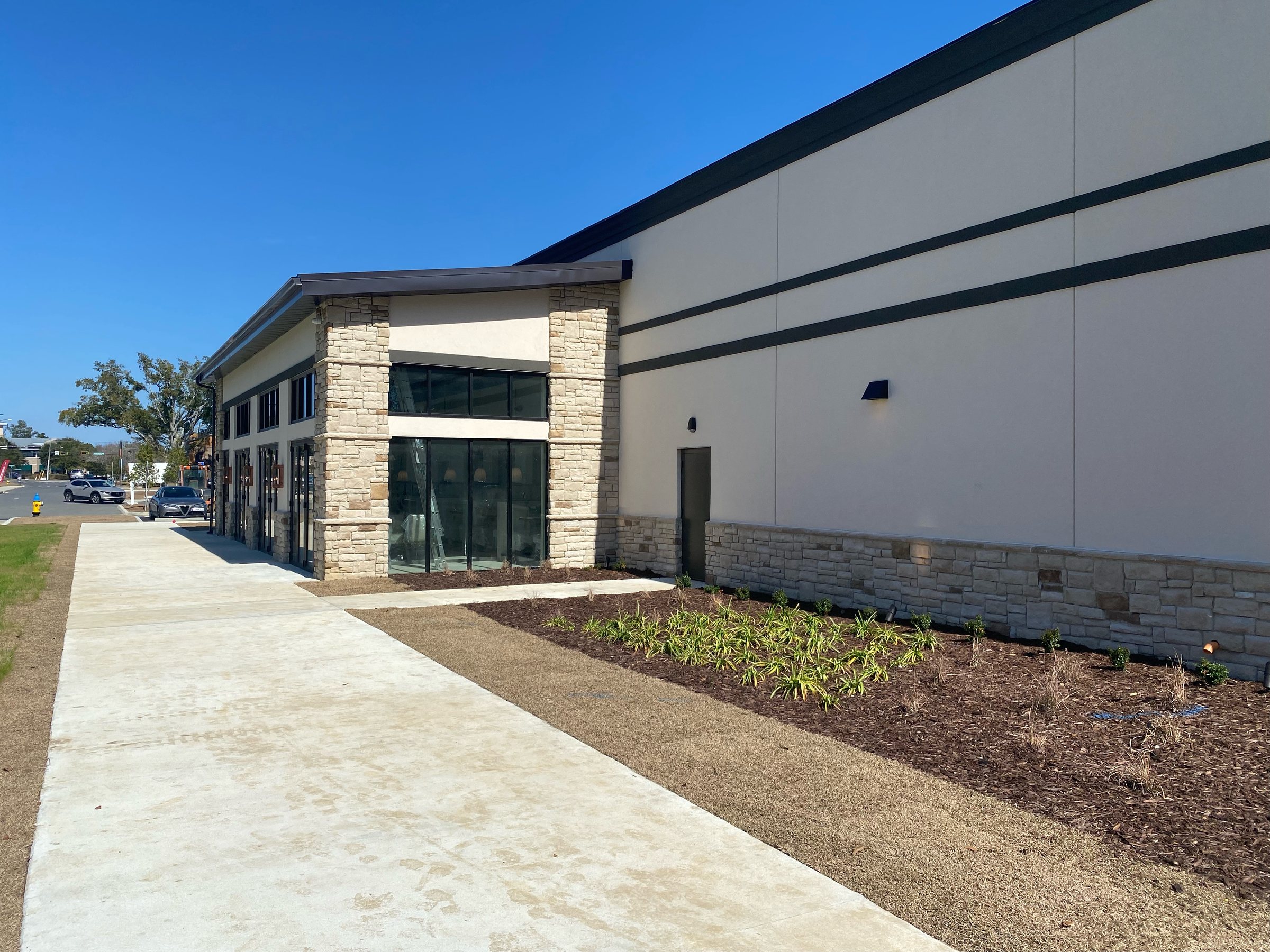 Foundation planting bed along the entrance of a new restaurant building
